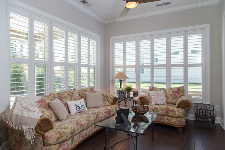 Traditional sunroom with plantation shutters in Fort Lauderdale.